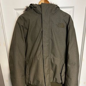 Olive green colored north face men’s jacket.